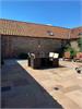 Stunning enclosed sunny courtyard /garden with table, chairs and bbq for alfresco dining.