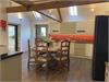Kitchen/Diner with vaulted ceiling and exposed beams.