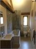 Large Family Bathroom with vaulted ceiling and beams.