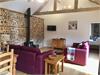 Open plan Lounge/ Kitchen/Diner with original exposed Brick & Flint wall, vaulted ceiling with beautiful beams. Central wood burner to lounge area.
