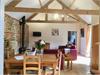 Open Plan Kitchen/Diner/Lounge with original Brick and Flint exposed wall and a beautiful wood burner.